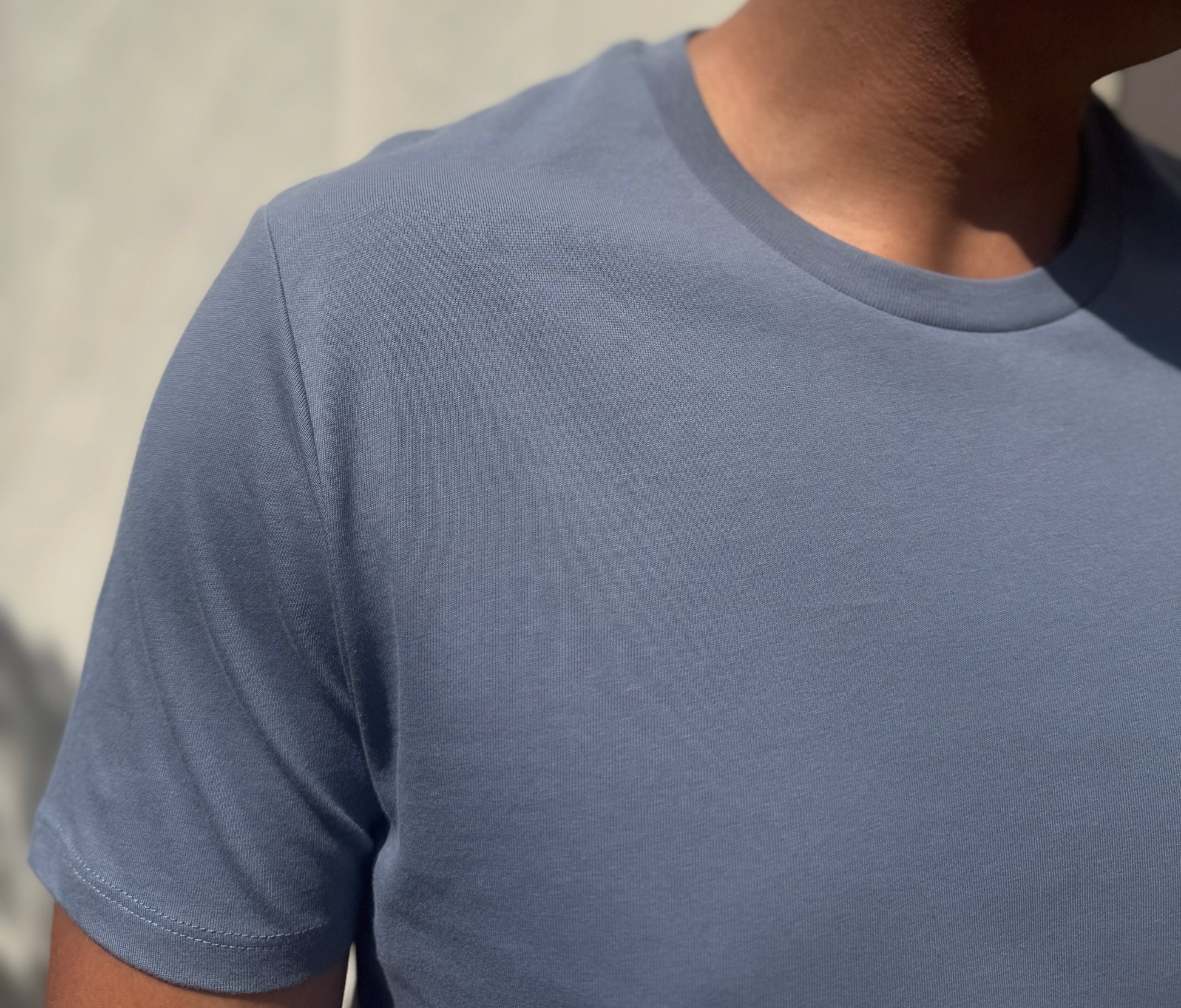 Blue 100% organic cotton crew neck shirt.
